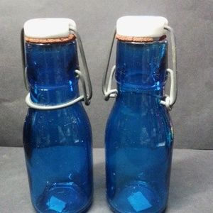 2 blue glass antique bottles